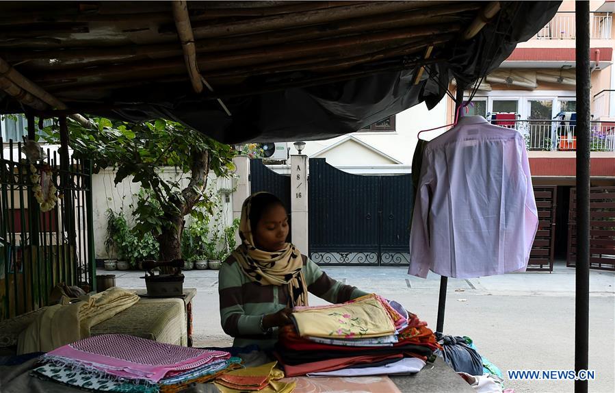 INDIA-NEW DELHI-CLOTHES-IRONING STAND