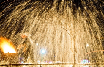 Folk artists spray molten iron to greet Lantern Festival in China's Inner Mongolia