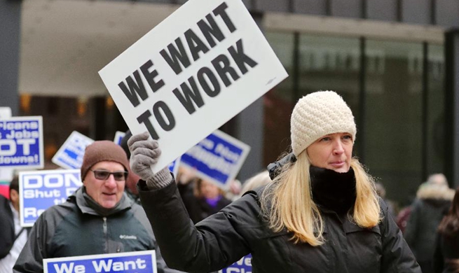 Federal employees, activists protest against government shutdown in Chicago